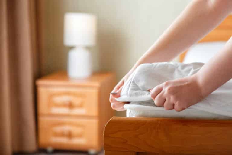 How to Make a Bed With a Mattress Topper: A Quick Guide