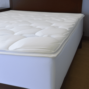 A mattress topper on top a thick mattress