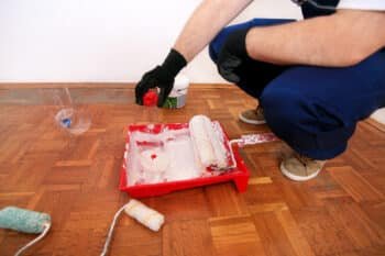 Construction worker doing finish renovation in the apartment