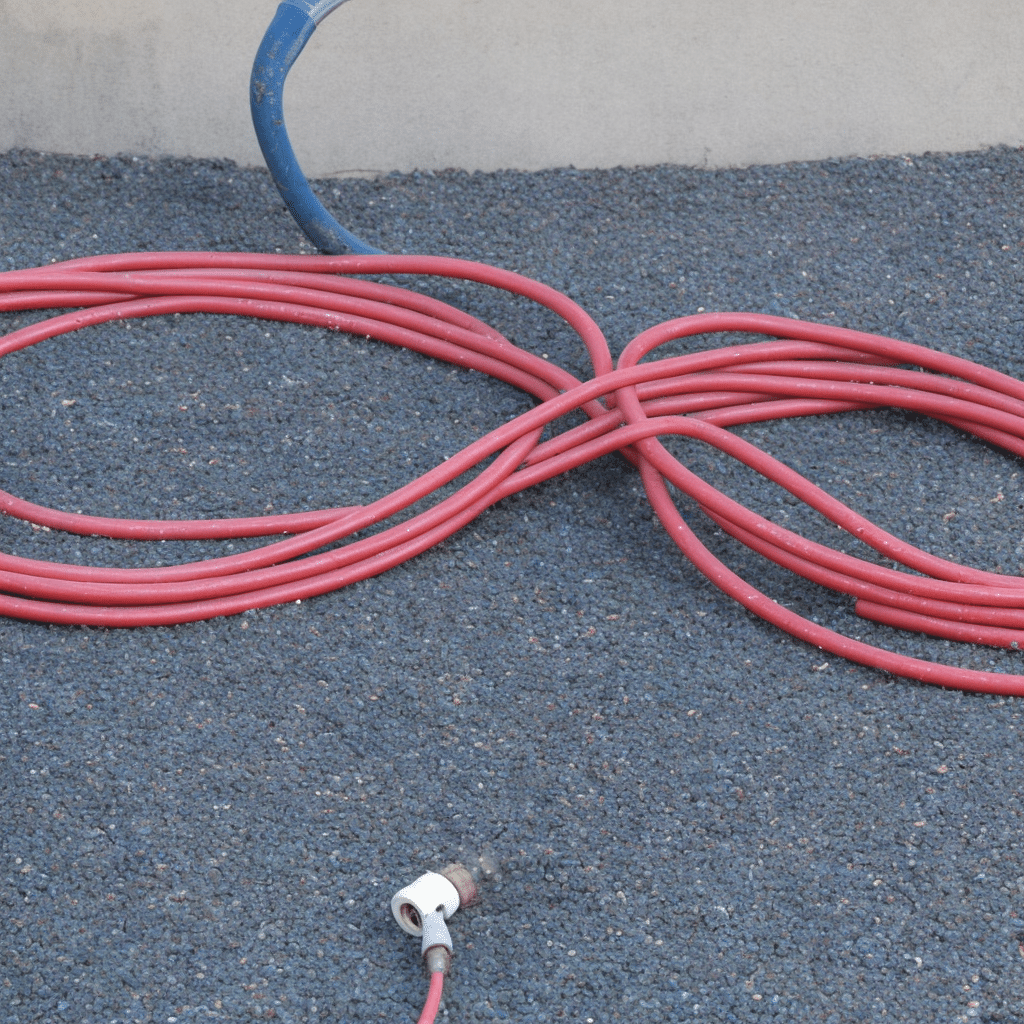Garden hose coiled in eight-figure pattern