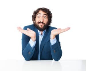 confused businessman with sit table
