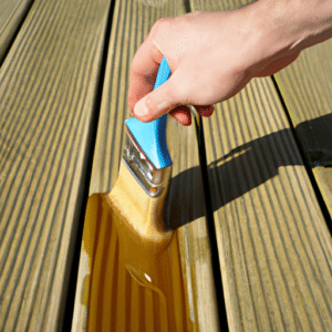 applying decking oil using a brush