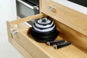 kitchen drawer with stacked pans