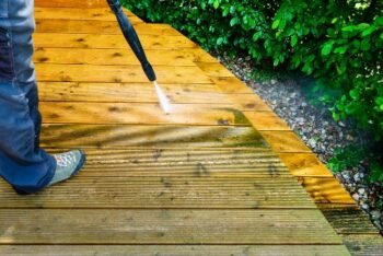man cleaning terrace