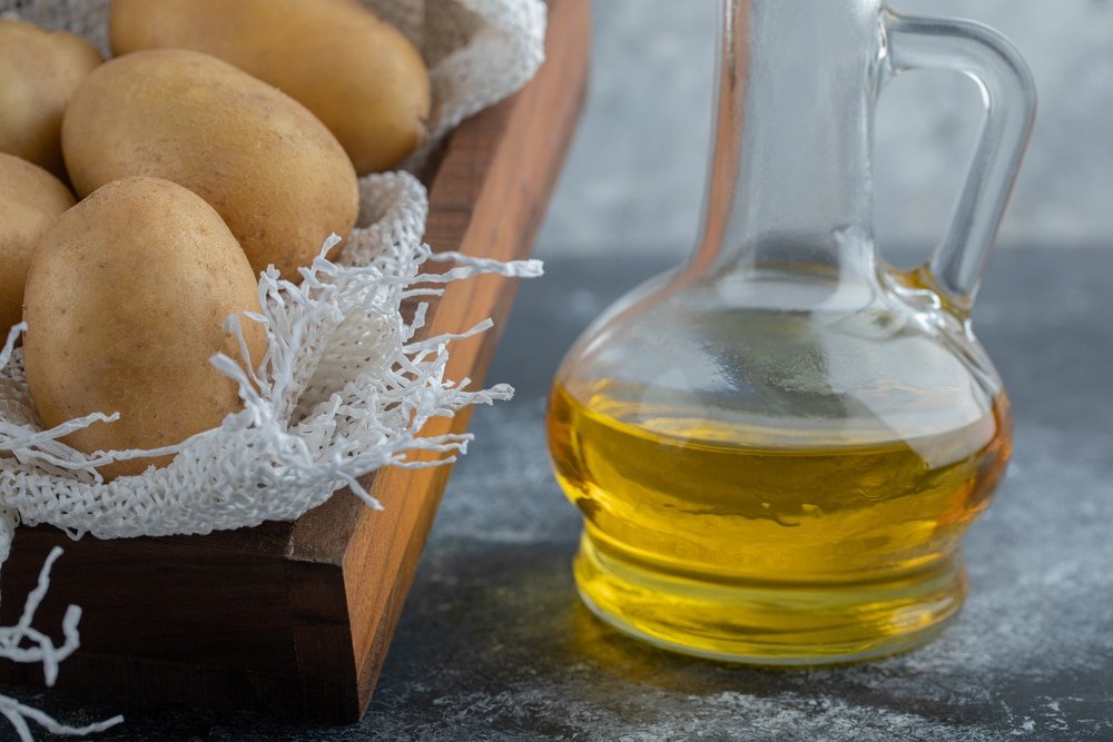 potatoes and a bottle of oil