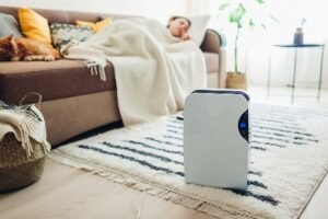 sleeping woman with cleaning appliance on the floor