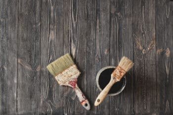 two old brushes on an old table
