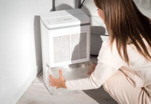 woman checking water in air dryer tank