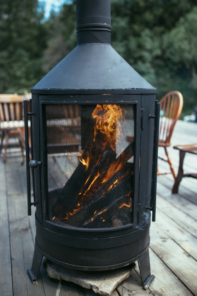 a fireplace stove with burning wood
