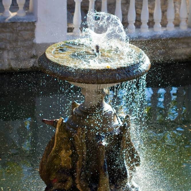 a fountain with sculptures of geese
