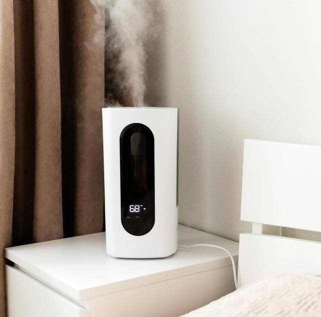 a humidifier on the nightstand