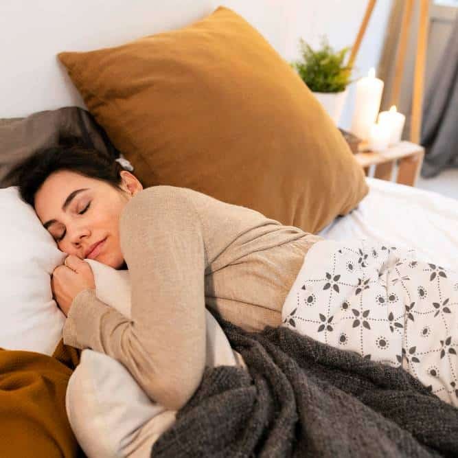 a lady sleeping peacefully in bed