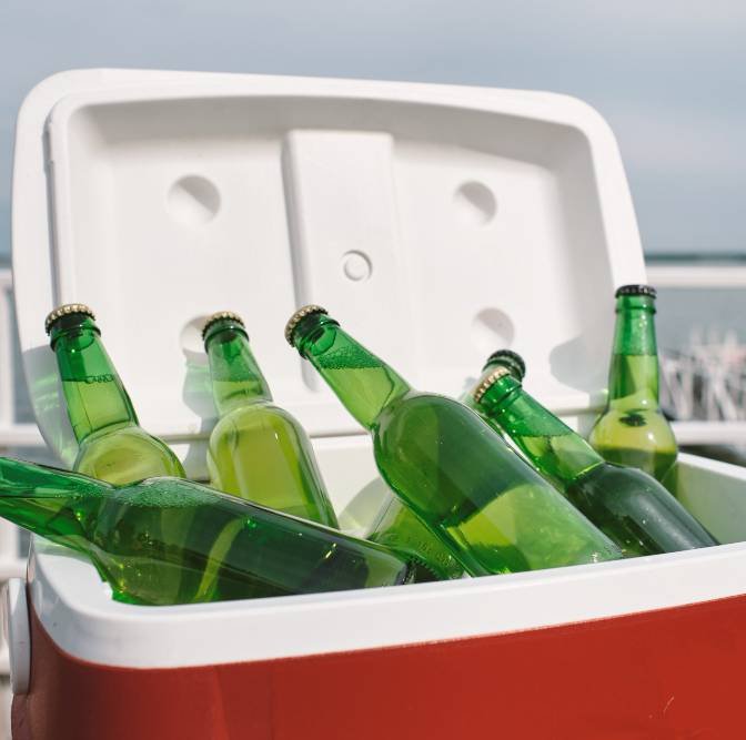 an electric cool box with a few beers