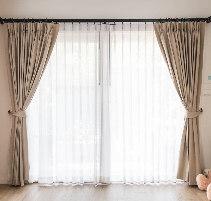 an interior decoration of curtains in the living room