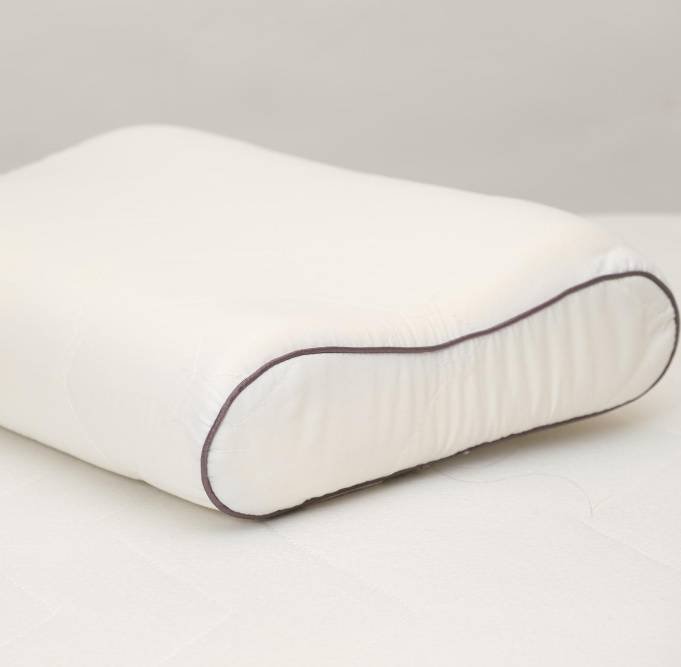an orthopedic pillow in bed
