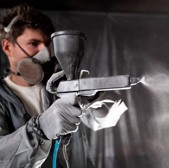 man working with paint gun